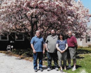 The photo is my sibs and me in front of the magnolia tree that was just a few branches when we moved into the house in 1964. This photo was taken for my mom's last Mother's Day in 2015.